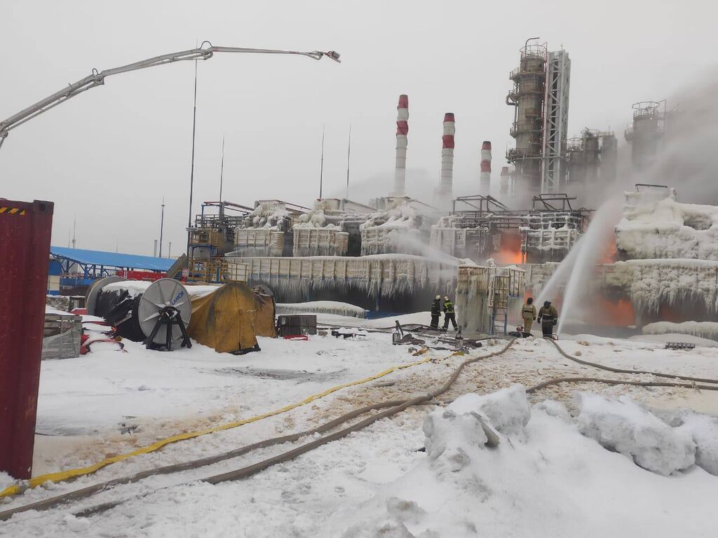 Rescuers working to extinguish the fire at the Ust-Luga gas terminal
