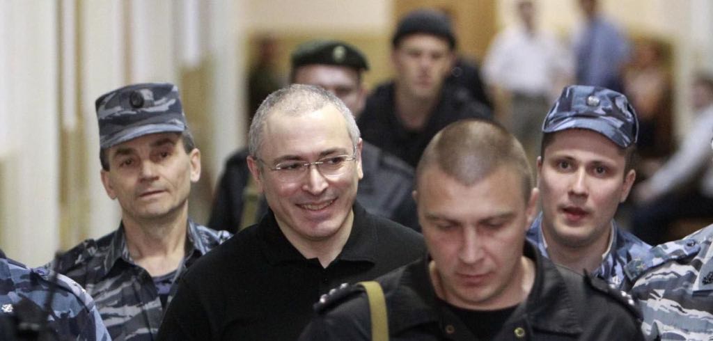 Mikhail Khodorkovsky is escorted to court in Moscow